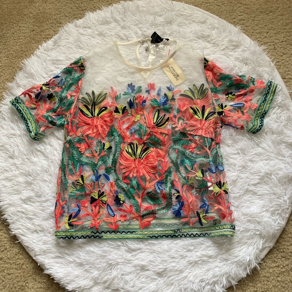 White sheer top with colorful floral detail